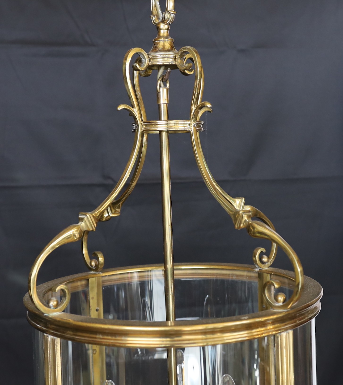 A large Georgian style brass hall lantern with internal bulb holder, height 79cm. diameter 38 cm